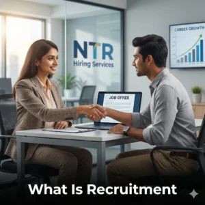Indian HR professional explaining what is recruitment to a job seeker in a modern office with NTR Hiring Services branding.